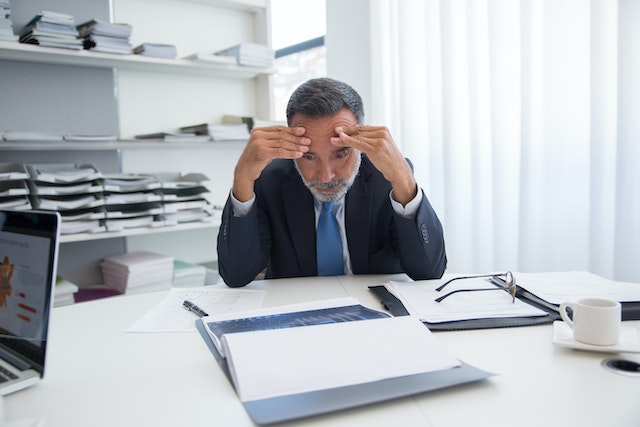 stressed man at desk