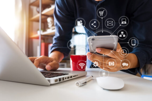 close up of hand using tablet ,laptop, and holding smartphone online banking payment communication network,internet wireless application development sync app, virtual graphic icon diagram